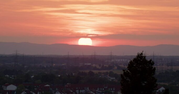 sunset timelapse over mountains and red sky
