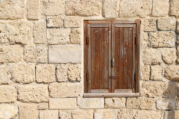 Fototapeta premium A small window on the facade of a large residential building.