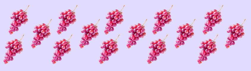 Many ripe grapes on lilac background. Pattern for design