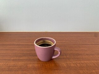 cup of coffee on wooden table