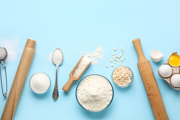Ingredients and utensils for baking on color background