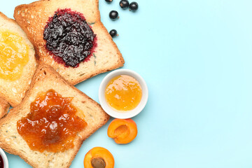 Delicious toasts with sweet jams on color background