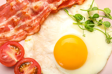 Tasty fried egg with bacon and tomatoes, closeup