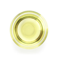 Glass bowl of sunflower oil on white background