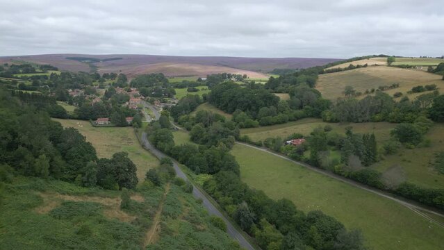 Approaching Hutton le Hole from the south through steep wooded valley.
A showpiece pretty village in the North York Moors