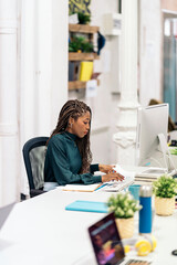 Fototapeta na wymiar African Woman Working in the Office