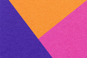 Fototapeta na wymiar Texture of craft bright purple, navy blue and orange shade color paper background, macro. Vintage abstract cardboard