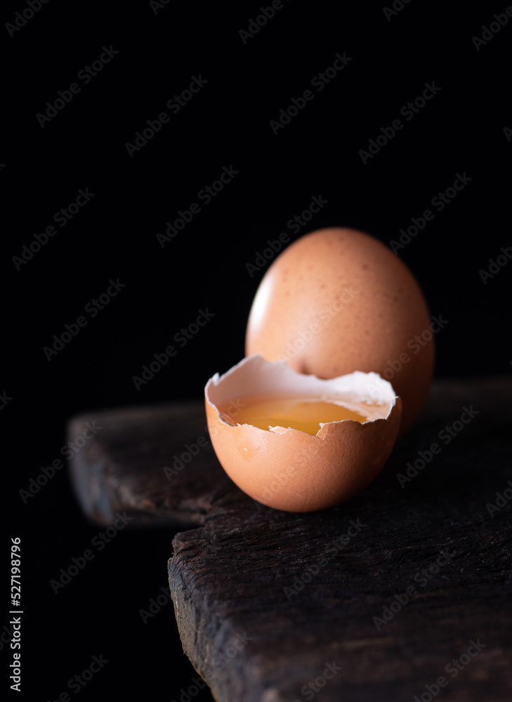 Sticker fresh eggs on wood ,dark background,copy space