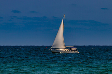 Fototapeta premium white yacht on sea water