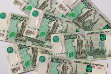 Russian money, banknote face value of one thousand rubles. Fall and devaluation of the russian ruble, crisis.