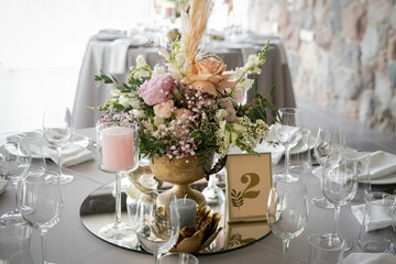 Beautiful wedding table setting with a floral arrangement