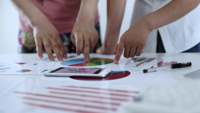 The financial team is meeting to analyze and discuss the performance data report.