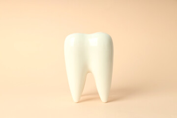Concept of dental care on beige background