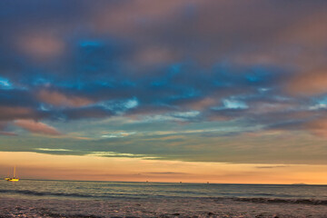 Fototapeta na wymiar Passing winter storm at sunset on the beach in Montecito California
