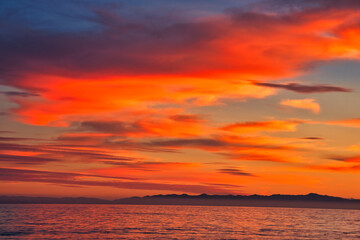 Fototapeta premium Passing winter storm at sunset on the beach in Montecito California