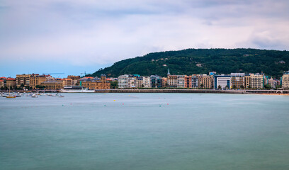 Panorama of La Concha bay, beach and waterfront houses in San Sebastian, Spain