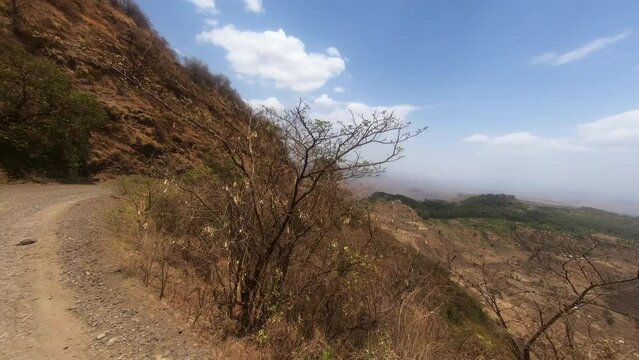 Four-wheel drive SUV car crossing Simien Semien mountain road. Drive And Travel Concept. Ethiopia, Africa wilderness