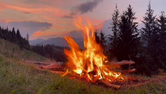 Campfire in the mountain. Camp Fire. Burning bonfire in the Carpathian mountains.