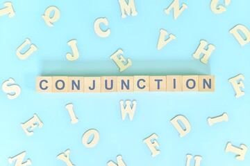 Conjunction concept in English grammar and learning class lesson. Wooden blocks typography word...