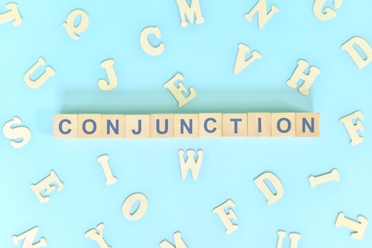 Conjunction Concept In English Grammar And Learning Class Lesson. Wooden Blocks Typography Word Flat Lay In Blue Background.