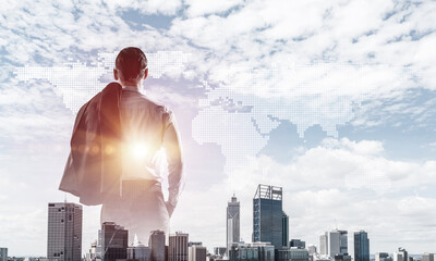 Concept of business success and control with confident boss against cityscape background