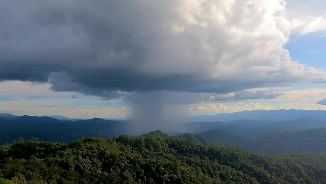 The drizzle of rain showered the beautiful sunshine in the valley. north thailand