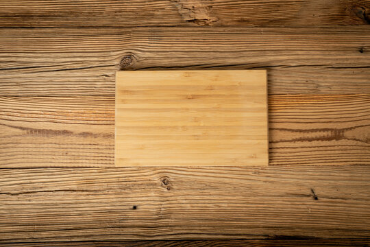Bamboo Cutting Board on a Old Wood Rustic Background