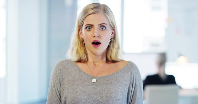 Shocked business woman with wow face at work, in surprise while working and alert in office at work. Portrait of an excited worker, employee or corporate person with crazy, amazed and omg expression