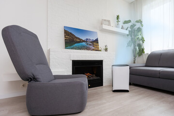 White Air purifier in living room for fresh air and healthy life. Copy space