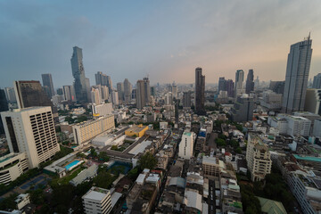 Tall skyscrapers feature urban architecture and modern Bangkok skylines. Bangkok city landscape sunset scenery.