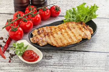 Grilled pork steak with ketchup