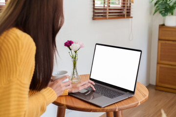 woman working on a white screen computer