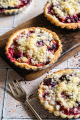Three home baked plum crumble tarts