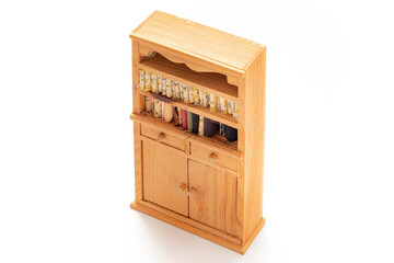 Wooden storage cabinet isolated on white background. Wooden toys. Kids toy. Miniature toy. Developmental toys. Kids room. Home decorative.
