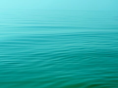 Blue sea water calm rippled surface background.