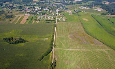 Aerial view of agro rural fields. Harvesting on the farm landscape