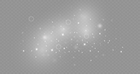 Dust sparks and stars shine with a special light. Christmas light effect. Glittering particles of magic dust.Vector sparkles on a transparent background.