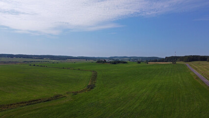 Naklejka premium Aerial view of agro rural fields. Harvesting on the farm landscape
