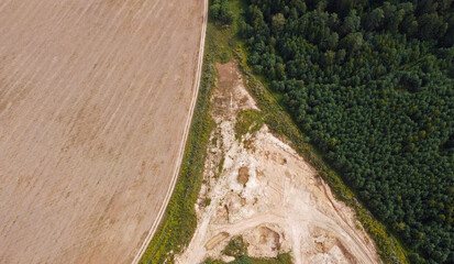 Aerial view of agro rural fields. Harvesting on the farm landscape