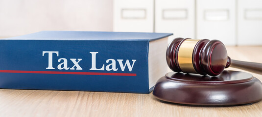 A law book with a gavel - Tax law