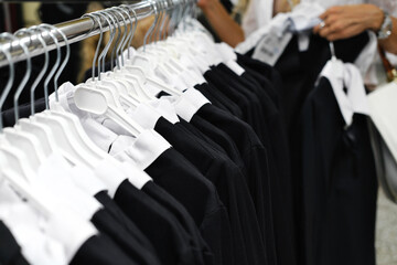 School clothes hanging in the mall on hangers