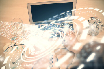 Double exposure of man's hands typing over computer keyboard and data theme hologram drawing. Top view. Technology concept.