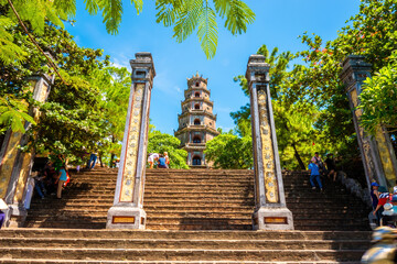 view of The Thien Mu Pagoda with many tourists. It is one of the ancient pagoda in Hue city. Near...