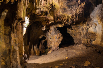 step stone staircase in the ruins of the ancient cave city. Underground river flowing in rock tunnel.