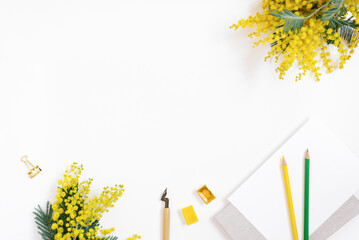 Flat lay of the workplace of a calligrapher blogger. A sheet of paper, a pen for calligraphy,...