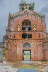 Fototapeta na wymiar An ancient church at La Vang Holy Sanctuary, It is the site of the Minor Basilica of Our Lady of La Vang, Quang Tri, Vietnam.