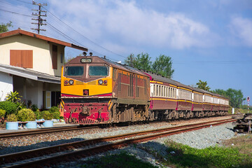 Naklejka premium Passenger train by diesel locomotive was arriving the station. (building is public)