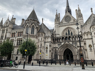 Naklejka premium London, UK. Royal Courts of Justice. The view of The Royal Courts of Justice from Strand. Street view.