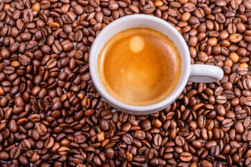 Coffee cup on natural coffee beans. International Coffee Day concept. October 1st.