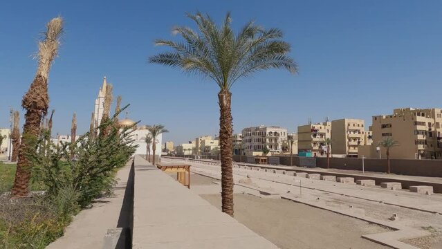 Establishing shot of Luxor Urban area with Abou al-Haggag Mosque background, Egypt